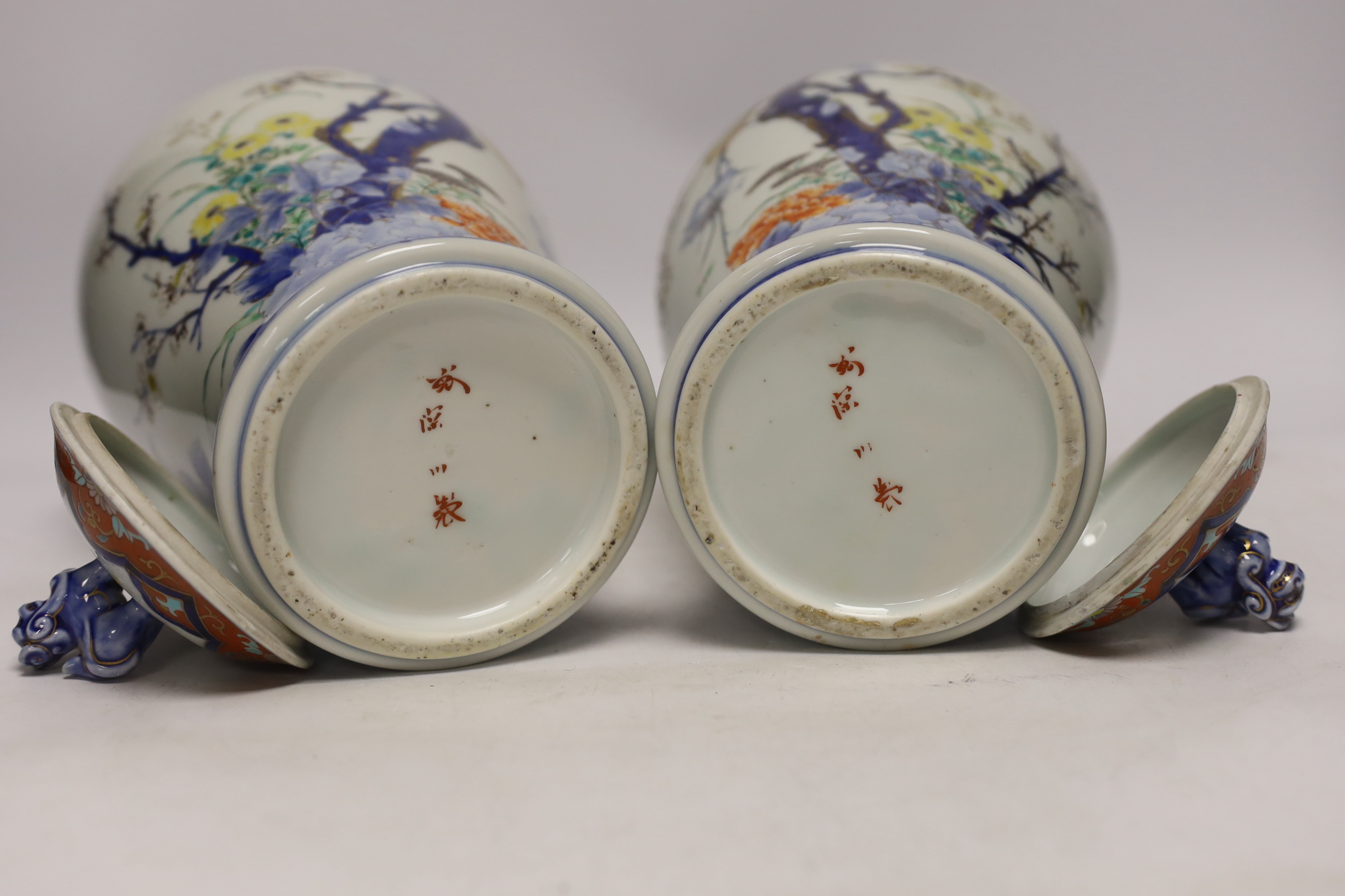 A pair of Japanese Imari vases and covers, by Fukugawa, koransha mark, 32cm high